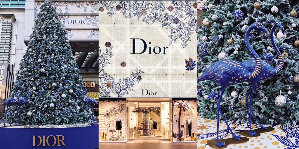 Dior 品牌店舖外擺放了藍色和白色聖誕裝飾的大型聖誕樹，旁邊有兩隻藍色火烈鳥雕塑，展示高端品牌如何打造頂級客製化VIP禮品。